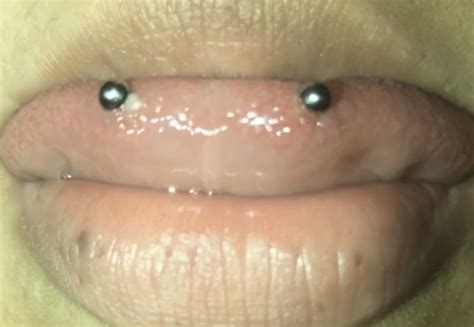 Just got my snake eyes pierced, no pain but is this normal or rejecting ...